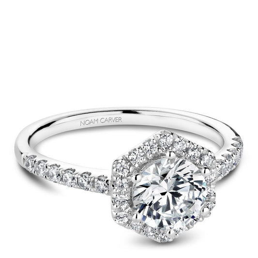 Halo diamond ring in white gold setting.