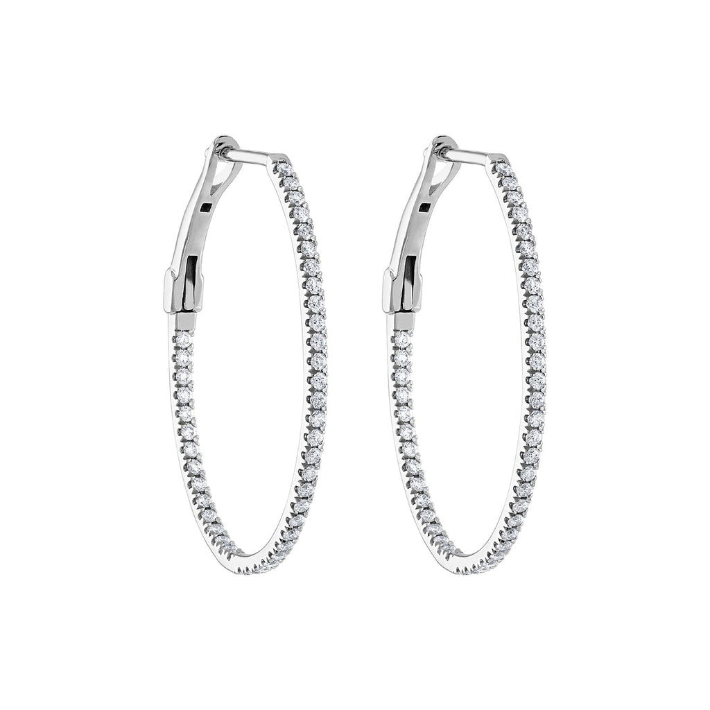 Oval white gold diamond hoop earrings.
