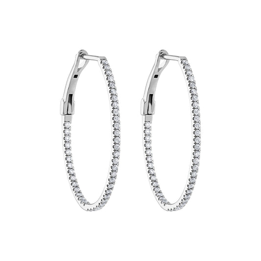 Oval white gold diamond hoop earrings.
