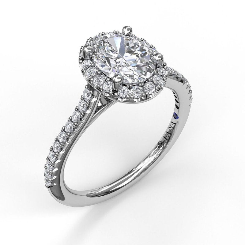 14K white gold diamond halo ring.