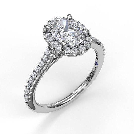 14K white gold diamond halo ring.