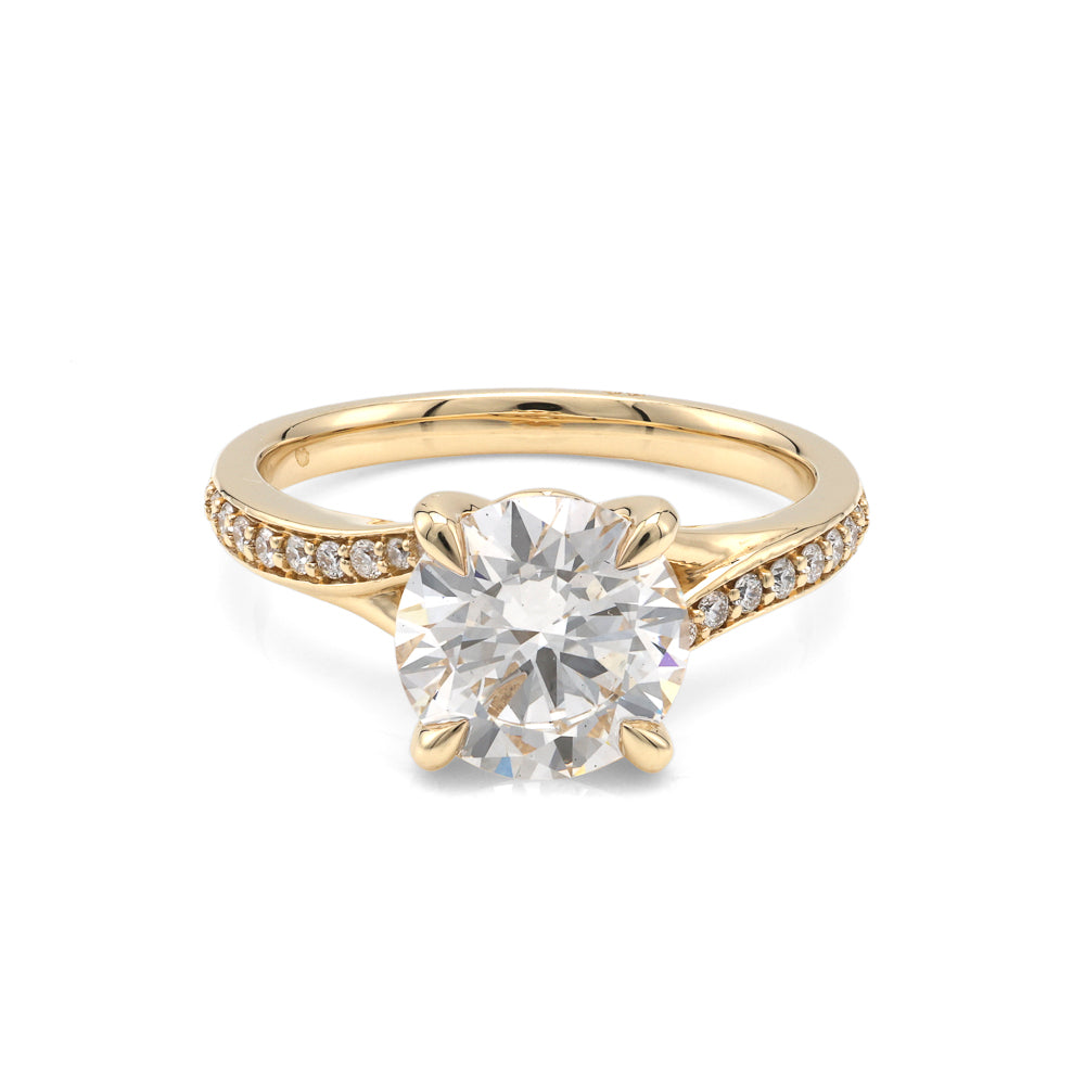 Yellow gold ring with round lab-grown diamond.