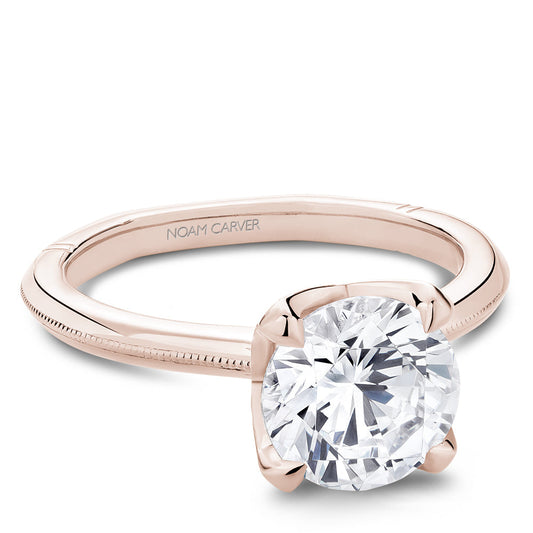 Rose gold ring with large central diamond.