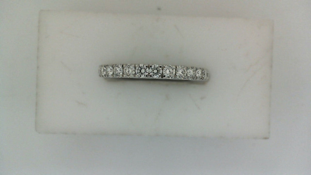 14K white gold band with round diamonds.