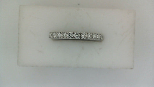 14K white gold band with round diamonds.