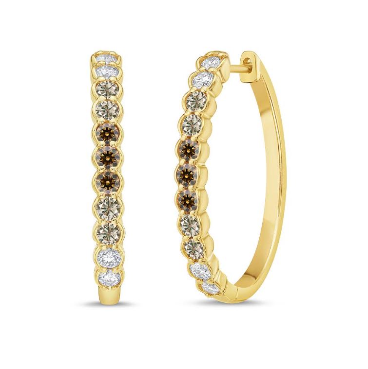 Oval gold hoop earrings with round diamonds.