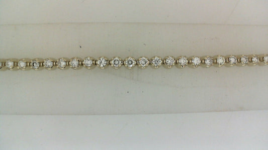 Diamond bracelet with round gemstones, elegant design.