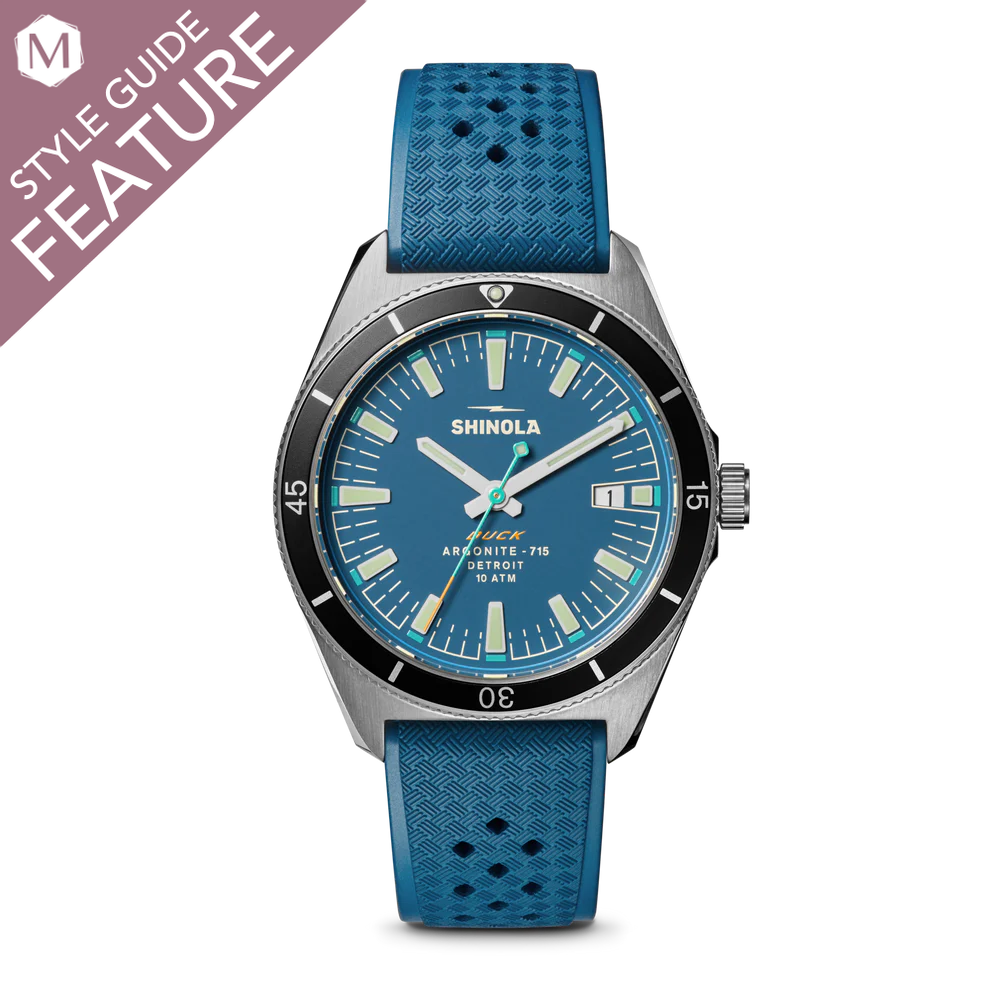 Blue dial watch with blue rubber strap.