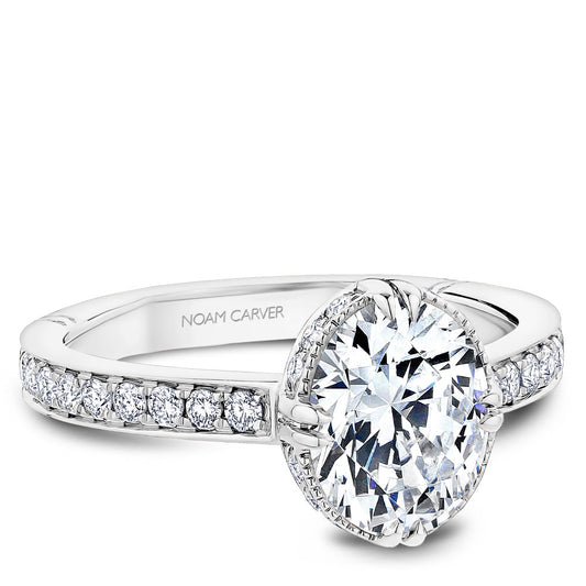 Vintage halo diamond ring in white gold.