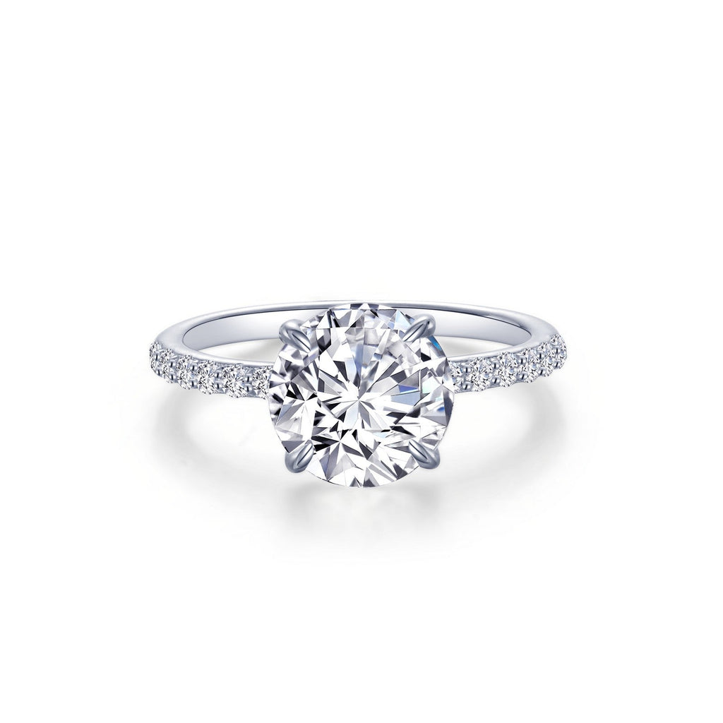 Simulated diamond ring with side stones.