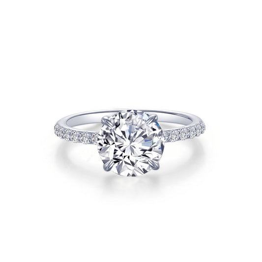 Simulated diamond ring with side stones.