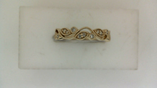 Vintage yellow gold band with diamond accents.