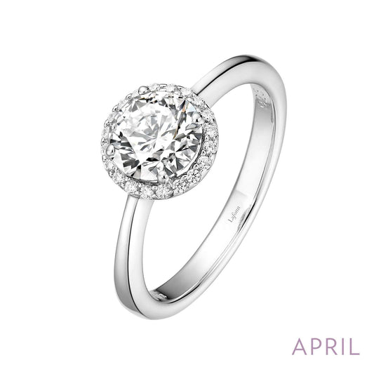 Halo ring with round simulated diamond centerpiece.