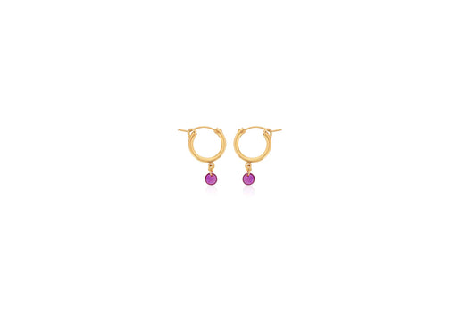 Gold hoop earrings with dangling rubies.
