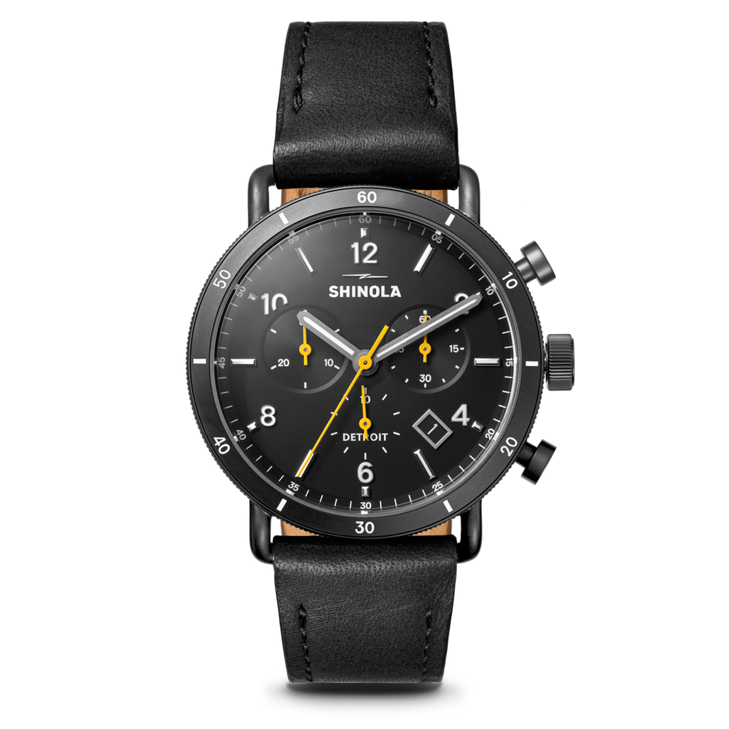 Black dial chronograph with leather strap.