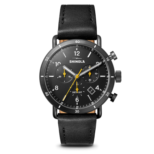 Black dial chronograph with leather strap.