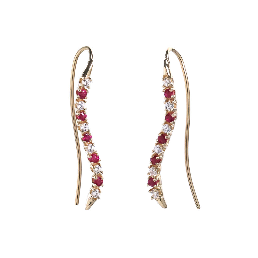 Ruby and diamond crawler earrings in gold.