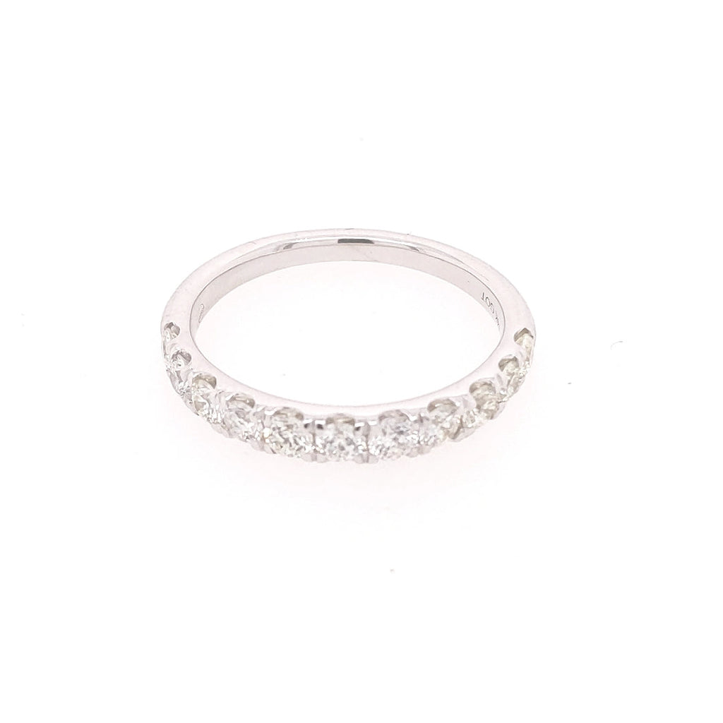 Diamond wedding band with round stones.