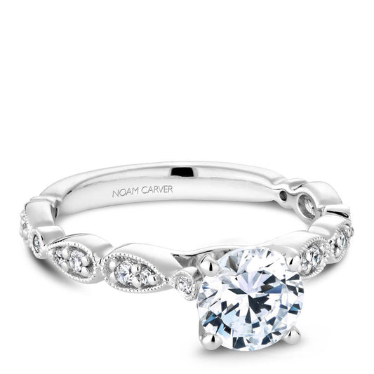 White gold ring with round and marquise diamonds.