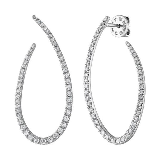 Teardrop-shaped diamond earrings in white gold.