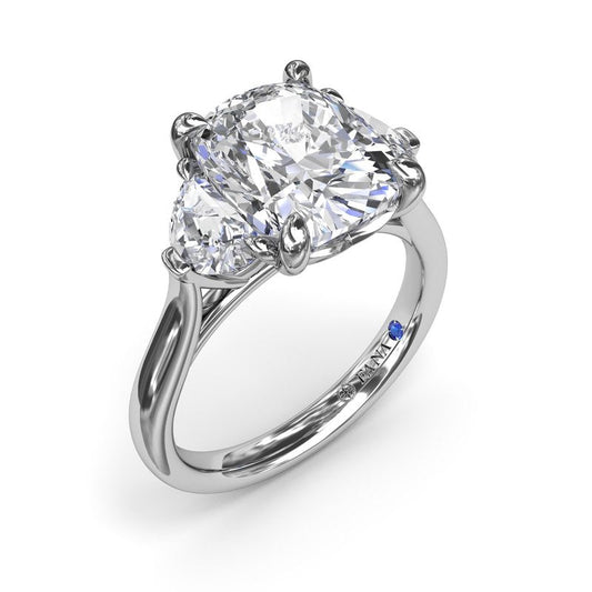 Three-stone diamond ring with half-moon accents.