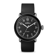 Black dial, stainless steel case, rubber band.