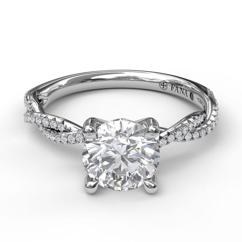 White gold ring with diamond accents and sapphire.