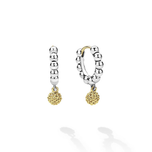 Sterling silver huggie earrings with gold accents.