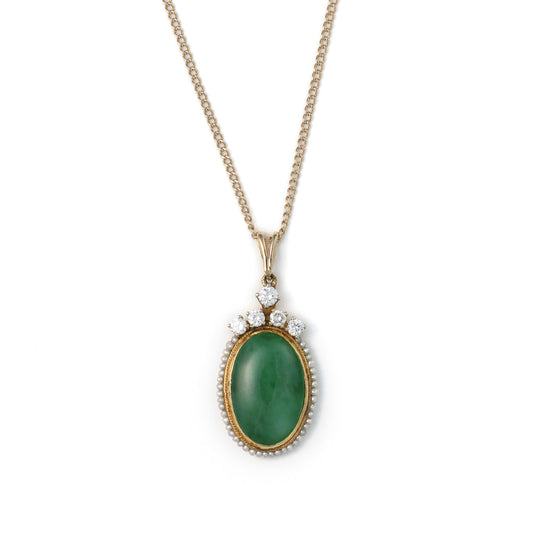 Green jade pendant with diamonds, yellow gold necklace.