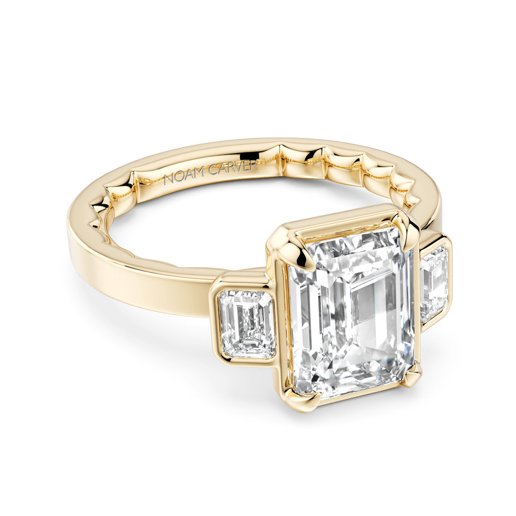 14K yellow gold ring with emerald diamonds.