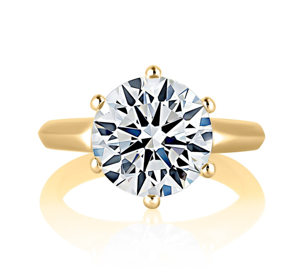 Solitaire diamond ring, yellow gold band.