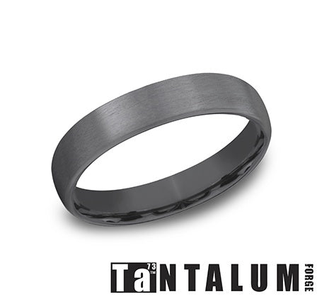Dark grey tantalum men's carved band.
