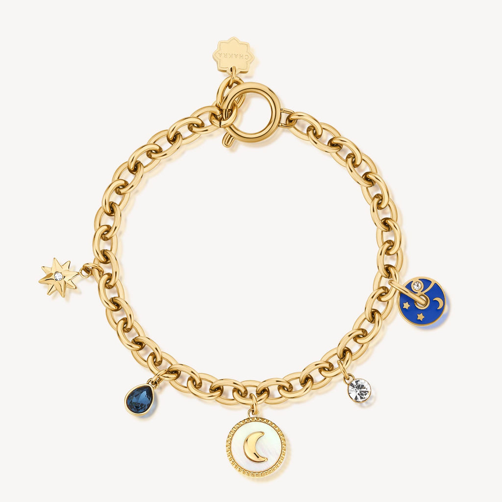 Yellow bracelet with moon, star, gemstone charms.