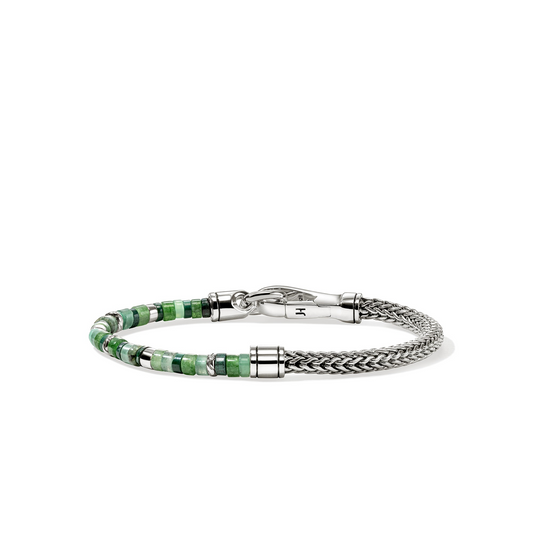 Sterling silver bracelet with green gemstones.