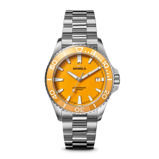 Yellow dial stainless steel dive watch.
