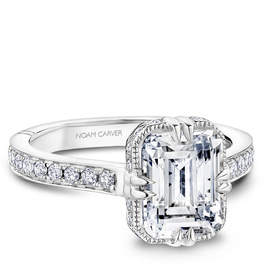 Vintage halo diamond ring in white gold.