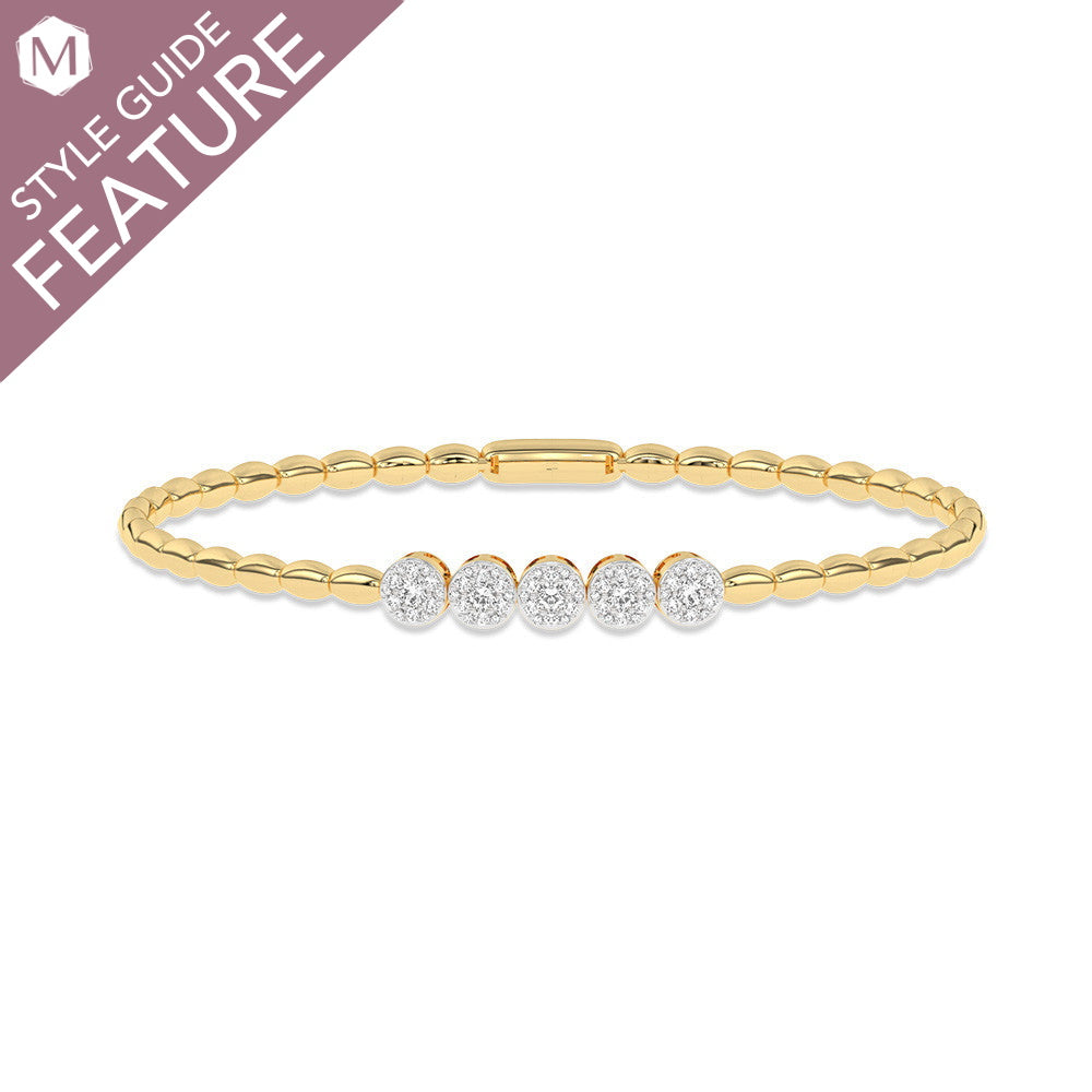 Yellow gold bracelet with diamond accents.