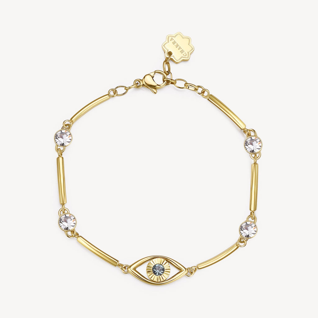 Yellow bracelet with blue and clear crystals.