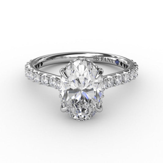 Oval diamond ring with round accent diamonds.
