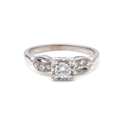 Vintage white gold ring with three diamonds.