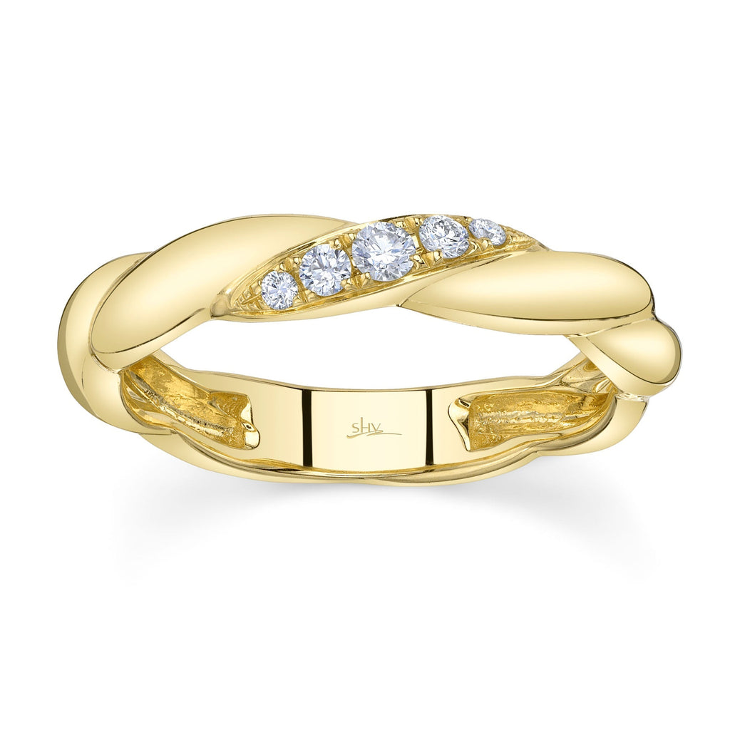 Twisted yellow gold band with diamonds.