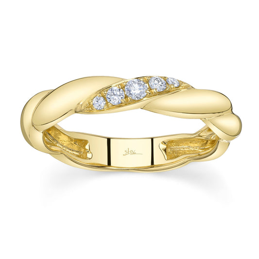 Twisted yellow gold band with diamonds.