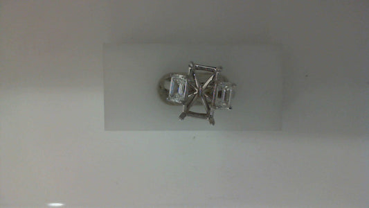 Emerald-cut diamond ring in white gold.
