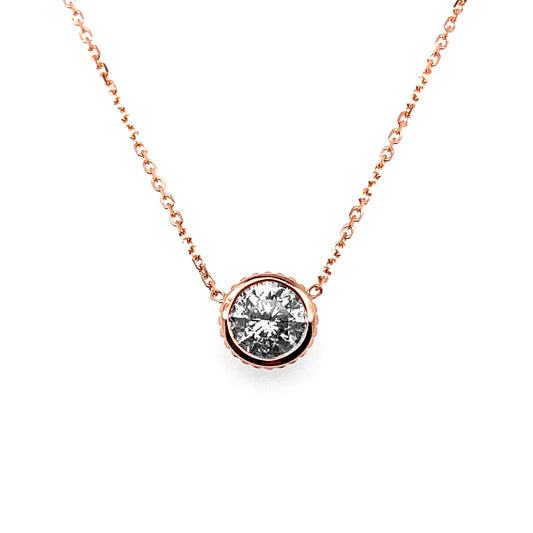 Rose gold necklace with round diamond centerpiece.