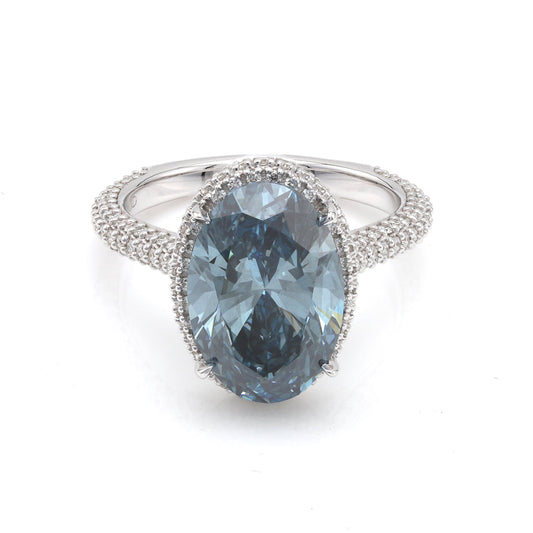 Blue oval diamond halo engagement ring.