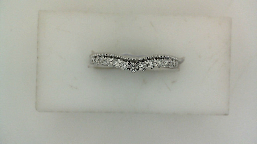 Contour wedding band with round diamonds.