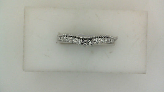 Contour wedding band with round diamonds.