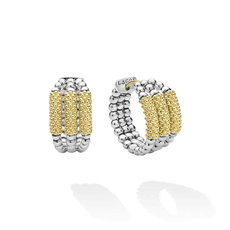 Sterling silver huggie earrings with gold beads.
