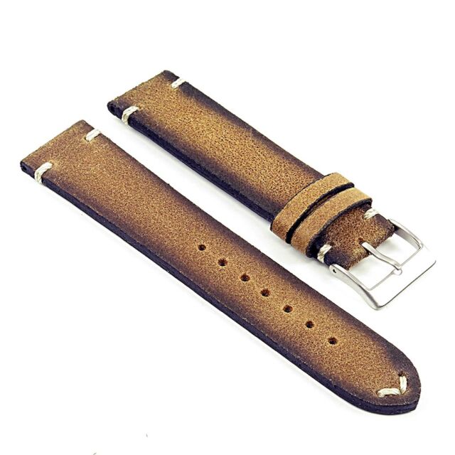 Tan leather watch band with tang buckle.