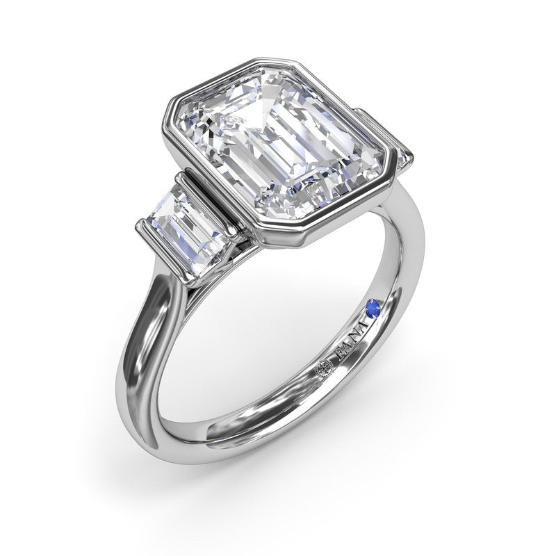 Emerald-cut diamond ring with side stones.